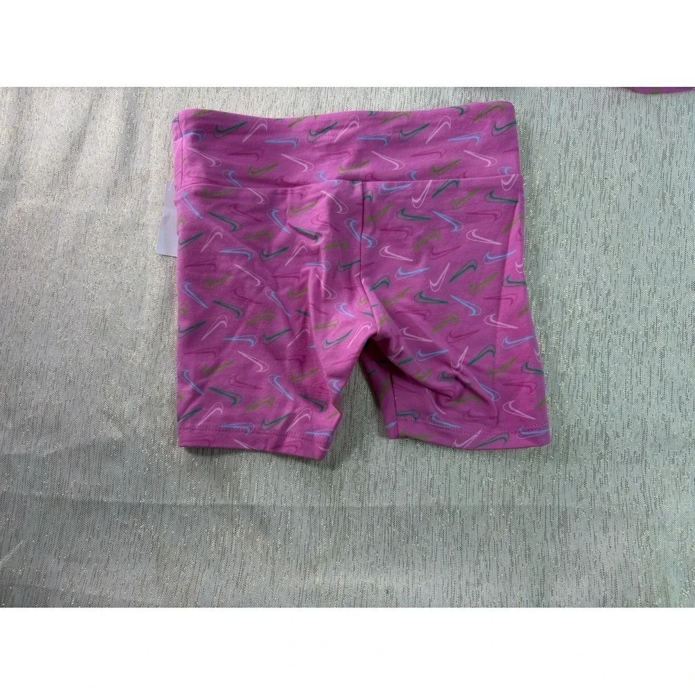Three pairs of pink Nike biker shorts, size 6X and 6